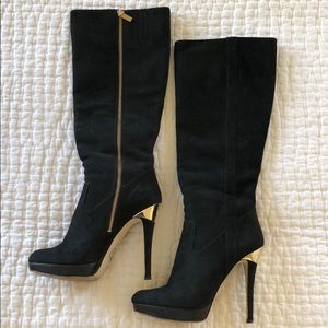 Black knee-high, high heeled boots